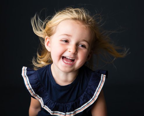 Smiling girl in family photo shoot