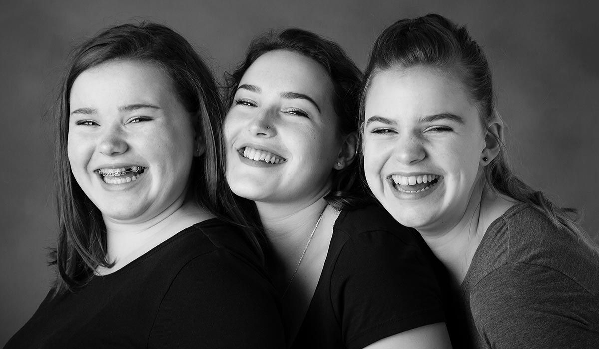 Laughing girls in photo studio