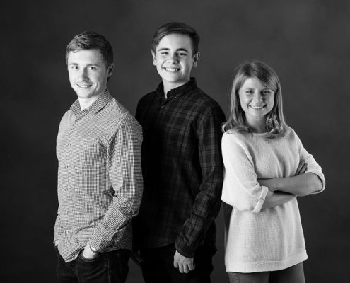 2 brothers and 1 sister in photography studio.