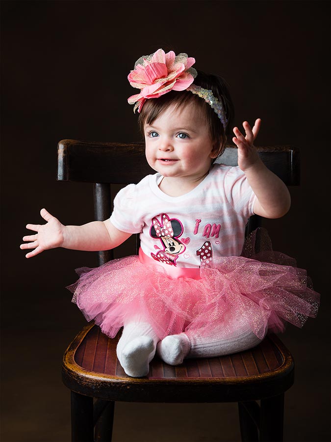 Little girl dancing in photo studio (pink outfit)