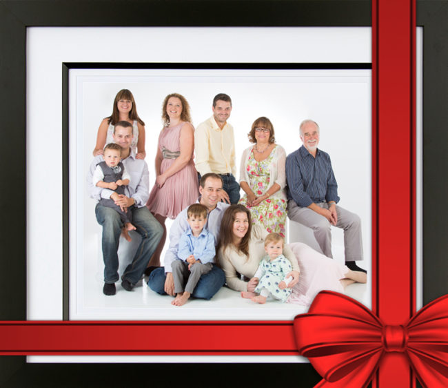 image of framed family portrait with red ribbon