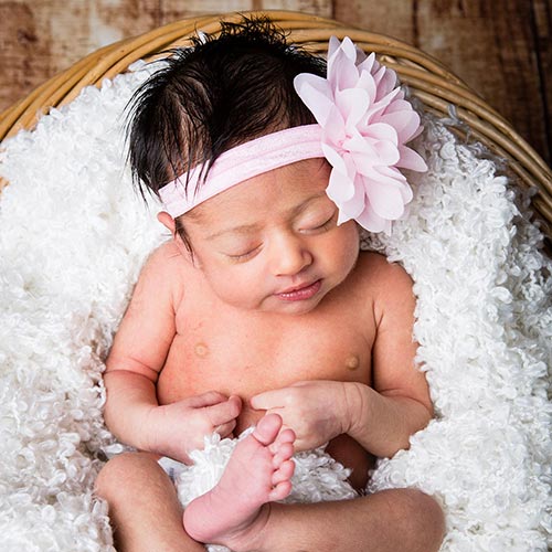 Newborn baby in photo studio